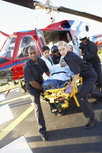 Paramedics unloading patient from Medevac