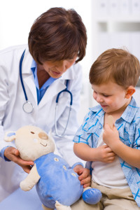 Doctor examining child